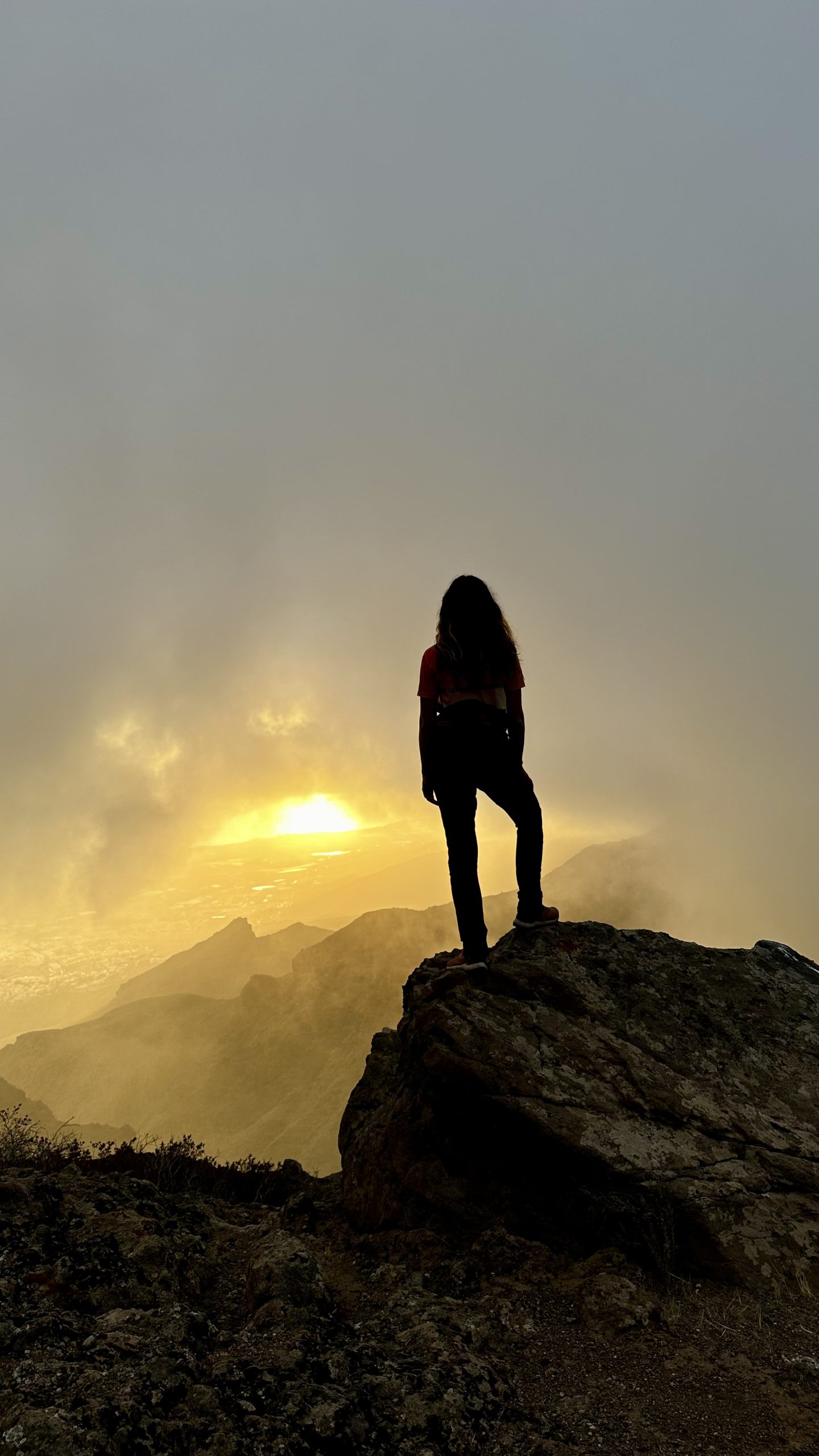 Julia at sunset above the clouds
